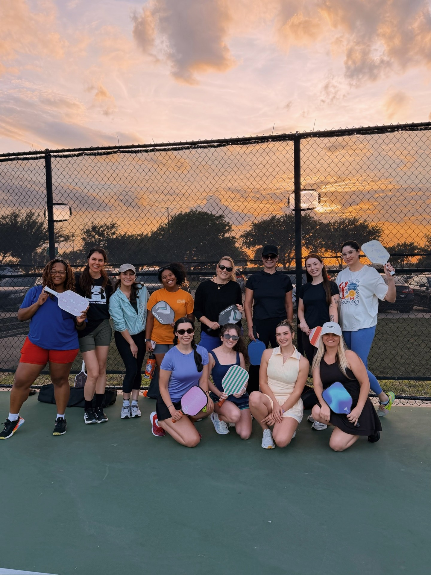 Women at a pickleball court